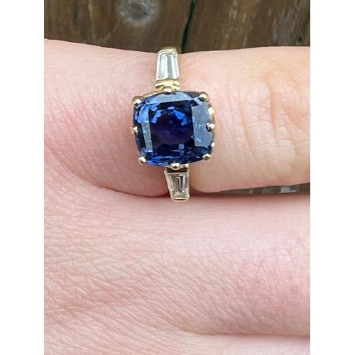 309 - An 18ct yellow gold certified sapphire and diamond three stone ring, the cushion cut sapphire (certi... 