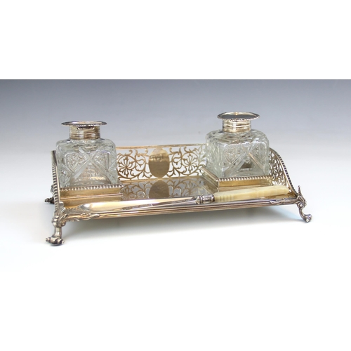 66 - A Victorian silver desk stand, Charles Stuart Harris, London 1892, of rectangular form with pierced ... 