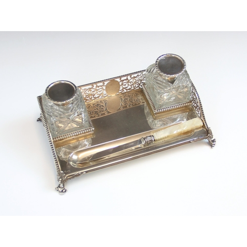 66 - A Victorian silver desk stand, Charles Stuart Harris, London 1892, of rectangular form with pierced ... 