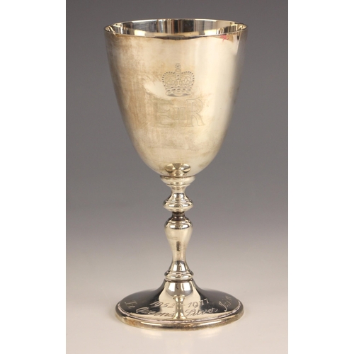 76 - An Elizabeth II commemorative silver chalice, Courtman Silver Ltd, London 1977, of typical form with... 