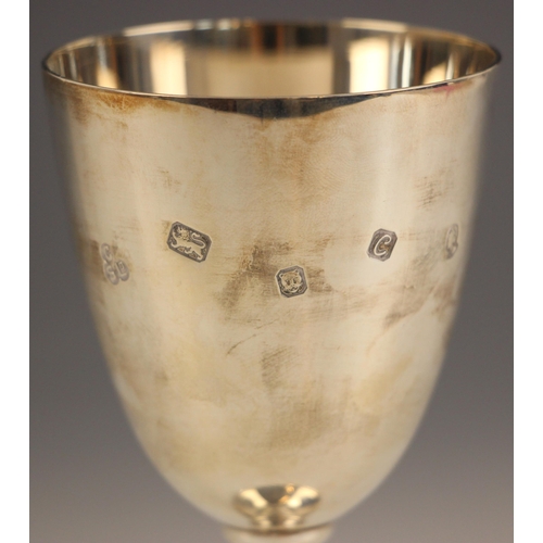 76 - An Elizabeth II commemorative silver chalice, Courtman Silver Ltd, London 1977, of typical form with... 