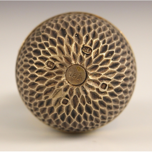 77 - A Stuart Devlin silver gilt surprise-egg, London 1976, No. 188, the textured egg opening to reveal g... 