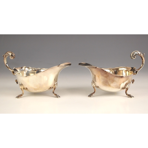 78 - A pair of silver sauce boats, S Blanckensee & Son Ltd, Birmingham 1939, each with cusped rims and fl... 