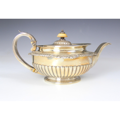 86 - A Victorian silver teapot, William Burwash, London 1861, the acanthus capped handle above flared rim... 