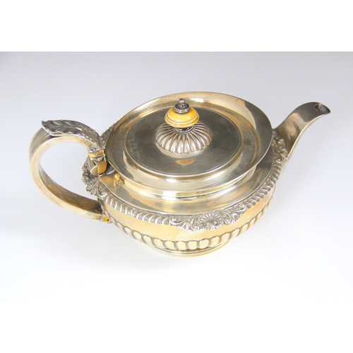 86 - A Victorian silver teapot, William Burwash, London 1861, the acanthus capped handle above flared rim... 