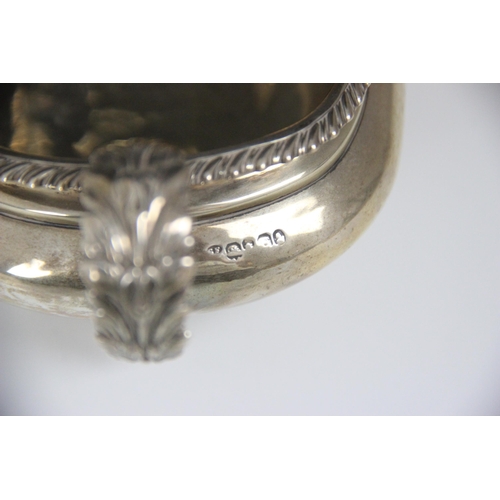 87 - A George IV silver milk jug, John James Keith, London 1828, the gadroon rim below cast leaf handle w... 