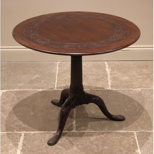 903 - A George II red walnut tripod table, possibly Irish, the circular top with an incised scroll frieze,... 