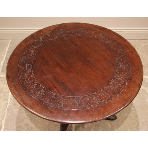 903 - A George II red walnut tripod table, possibly Irish, the circular top with an incised scroll frieze,... 