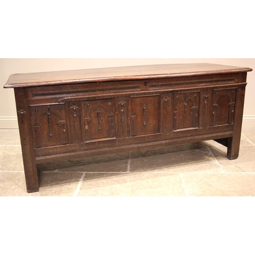 904 - A 17th/18th century oak coffer, the moulded plank top opening to a later lined interior and a fitted... 