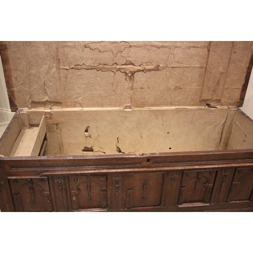 904 - A 17th/18th century oak coffer, the moulded plank top opening to a later lined interior and a fitted... 