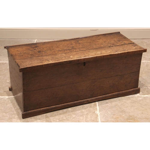 928 - A late 18th/early 19th century oak linen chest, of rectangular form with hinged cover, opening to a ... 