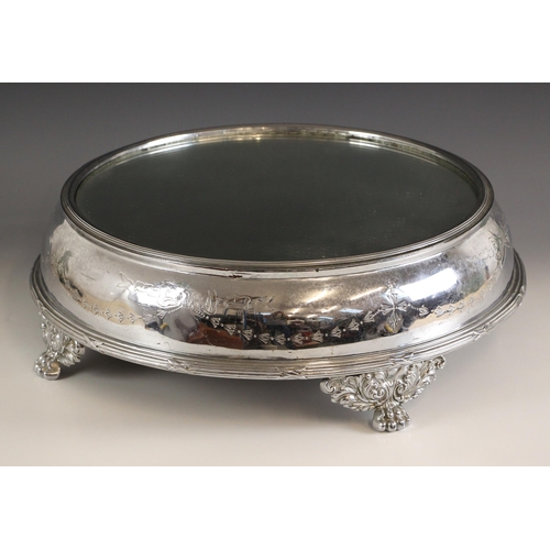 93 - A large silver plated plateau (surtout de table), the circular stand with mirrored plate top, with b... 