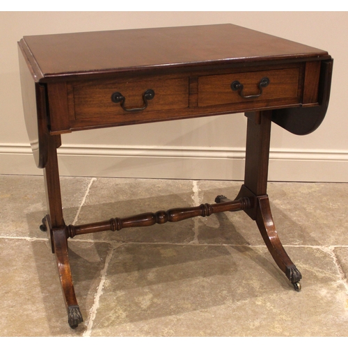 934 - A Regency style mahogany sofa table, mid 20th century, the rectangular drop leaf top with rounded co... 