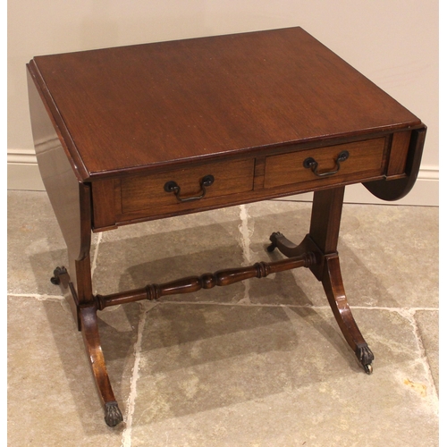 934 - A Regency style mahogany sofa table, mid 20th century, the rectangular drop leaf top with rounded co... 