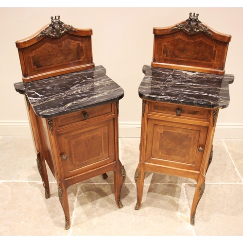 956 - A pair of Louis XV style walnut and marble topped bedside cupboards, early to mid 20th century, each... 