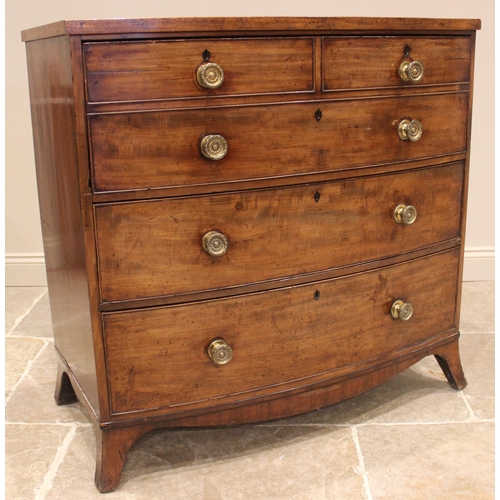 962 - A George IV mahogany bowfront secretarie chest of drawers, the fall front moulded as two short and o... 