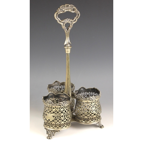 97 - A 19th century style EPNS three-division bottle cruet or tantalus, the cast handle above tapered ste... 