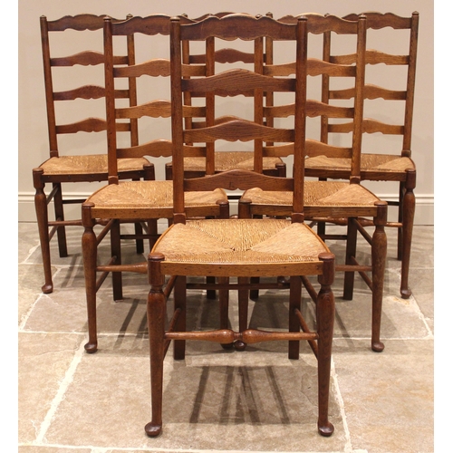 972 - A set of six oak Lancashire ladder back dining chairs, late 19th/early 20th century, each with four ... 