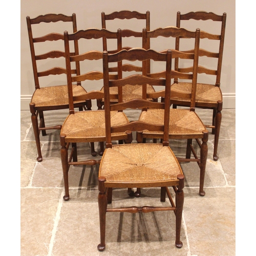 972 - A set of six oak Lancashire ladder back dining chairs, late 19th/early 20th century, each with four ... 