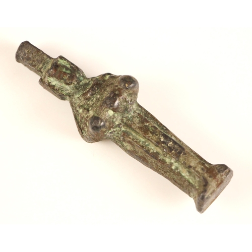 317 - A South East Asian patinated bronze pipe tamper/opium weight, 18th century, modelled as a deity stan... 