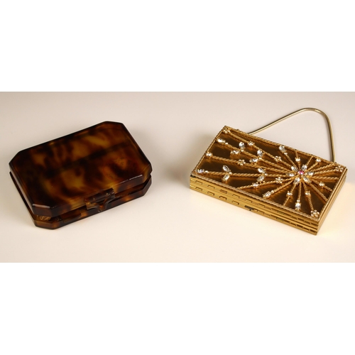 323 - An Art Deco style gold coloured evening bag/vanity case, of rectangular form, decorated with a styli... 