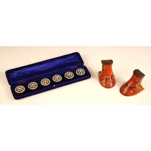 327 - A cased set of 20th century paste set buttons, the stylised flower head designed button with closed ... 