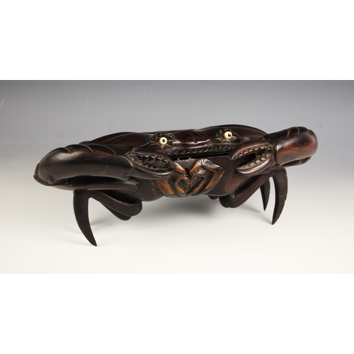 883 - A Japanese carved wood crab box, Meiji Period (1868-1912), modelled realistically standing with ivor... 