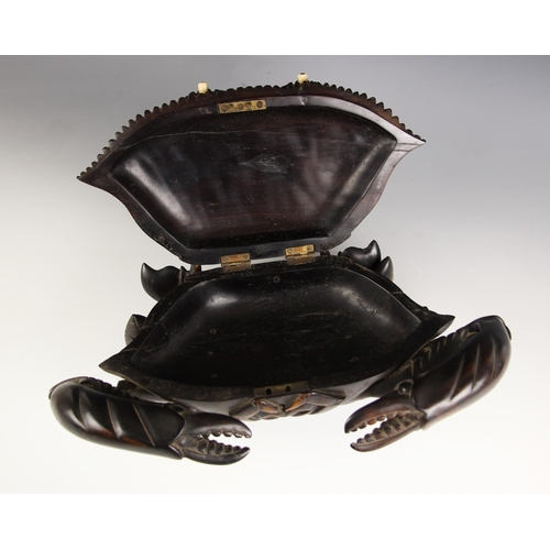 883 - A Japanese carved wood crab box, Meiji Period (1868-1912), modelled realistically standing with ivor... 