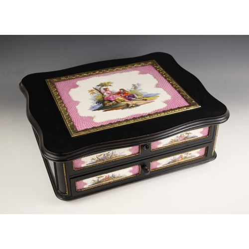 885 - A KPM tile and ebonised ladies toilet box circa 1860, the serpentine outlined hinged cover inset wit... 