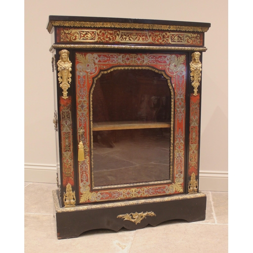 1010 - A French ebonised and boulle work vitrine, 19th century, the single glazed door opening to a velour ... 