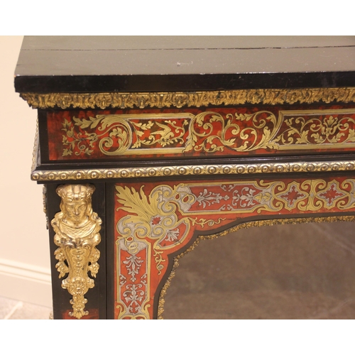 1010 - A French ebonised and boulle work vitrine, 19th century, the single glazed door opening to a velour ... 