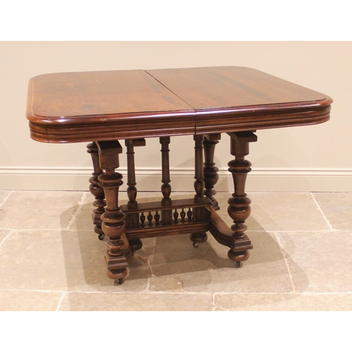 1053 - A French walnut country dining table, early 20th century, the polished rounded rectangular top raise... 