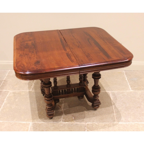 1053 - A French walnut country dining table, early 20th century, the polished rounded rectangular top raise... 