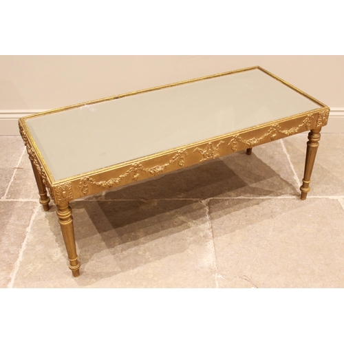 1054 - A painted giltwood coffee table, in the 18th century Italian taste, the rectangular bevelled mirror ... 