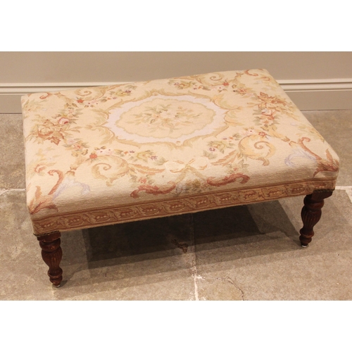 1063 - An Aubusson type tapestry upholstered footstool, late 20th century, the rectangular padded seat in f... 