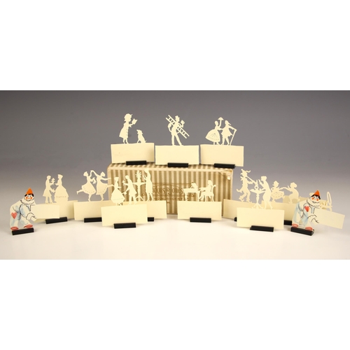 329 - A selection of ivorine placename holders, 20th century, depicting scenes of ladies dancing, courting... 