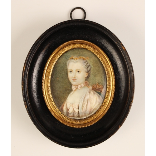 336 - French school (18th century),  
A half length portrait miniature depicting a seated lady wearing a p... 