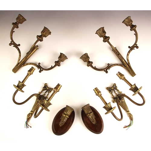 729 - A pair of three branch patinated brass candle sconces, 20th century, the central column supporting t... 