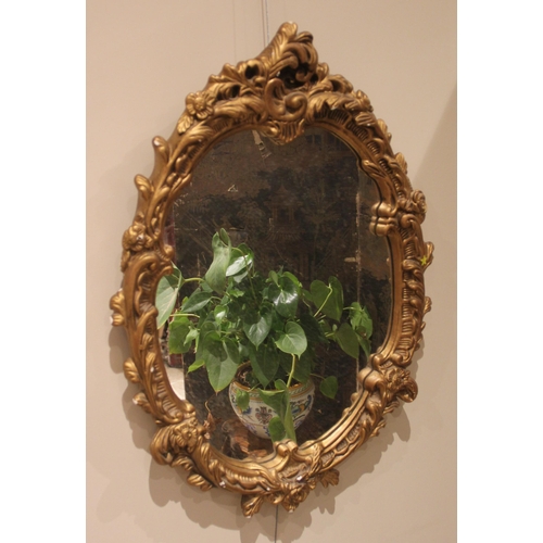 873 - A George III style mahogany fretwork wall mirror, with painted gilt phoenix crest, 80cm x 49cm, late... 