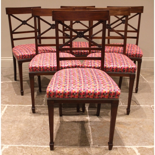 975 - A mahogany breakfast table, 19th century, the rectangular top with rounded corners upon four channel... 