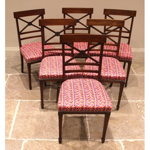 975 - A mahogany breakfast table, 19th century, the rectangular top with rounded corners upon four channel... 