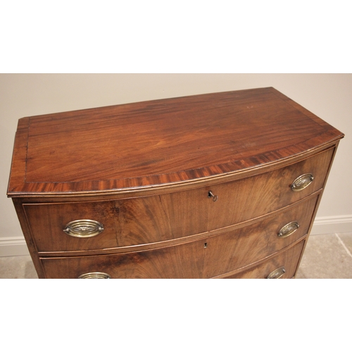 923 - A mahogany bowfront chest of drawers, early 19th century, the crossbanded top with a reeded edge ove... 