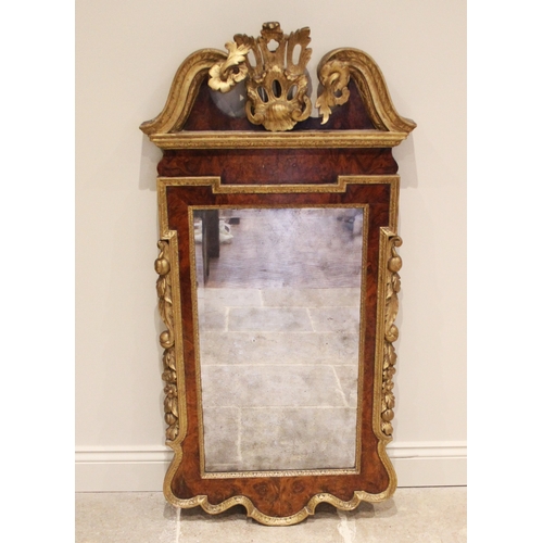 867 - A George II style walnut, giltwood and gesso wall mirror, 19th century, the openwork acanthus crest ... 