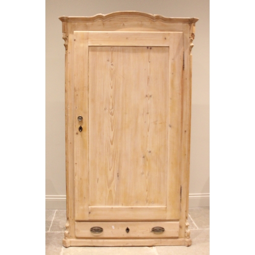 999 - A Victorian pine hall cupboard, the arched and moulded cornice over a single panelled door opening t... 