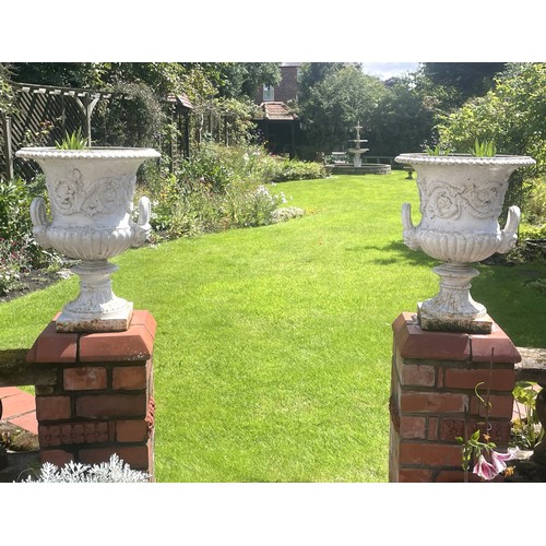 855 - A pair of Victorian style cast iron Campana shaped garden urns, 60cm H x 47cm D