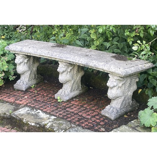 860 - A Haddonstone curved garden bench, on three pedestals, 150cm wide