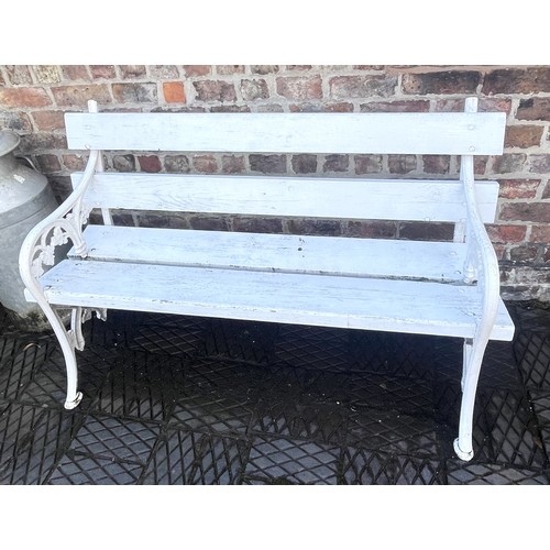 863 - A painted Coalbrookdale style cast iron and hardwood garden bench