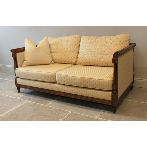 1026 - An Empire style canape, the stained beech wood frame enclosing bespoke floral cushions, 74cm H x 175... 