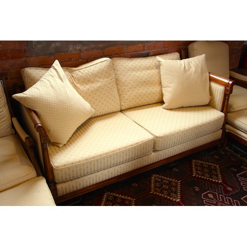 1026 - An Empire style canape, the stained beech wood frame enclosing bespoke floral cushions, 74cm H x 175... 