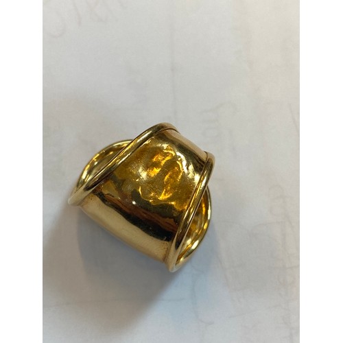 168 - A yellow metal dress ring, the tapered open ring with applied oval pad depicting lady, ring size N, ... 